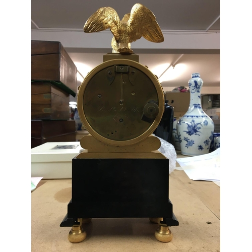 1513 - A Victorian mantle clock, made in London- the dial having Roman numerals, surmounted by a brass eagl... 