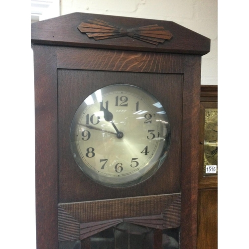 1517 - A circa 1920s oak longcase clock with Art Deco influence, approx height 192cm. Shipping category D.