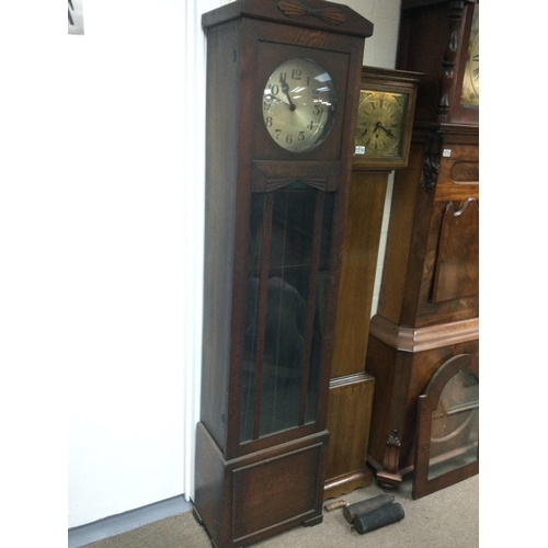 1517 - A circa 1920s oak longcase clock with Art Deco influence, approx height 192cm. Shipping category D.