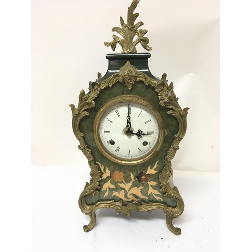 1526 - A French Louis XV style clock with gilt metal mounts fitted with a brass movement striking on a bell... 