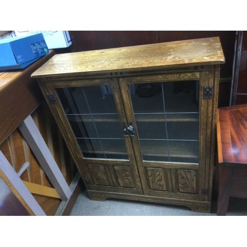 1537 - An oak bookcase with lead light doors, approx 93cm x 29cm x 111cm.