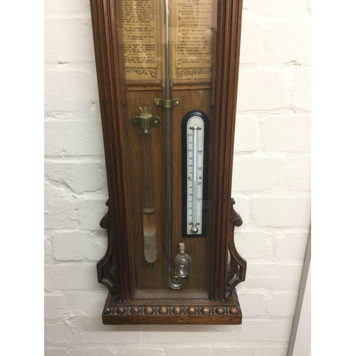 1539 - A late Victorian carved oak Admiral Fitzroy barometer, approx height 128cm.