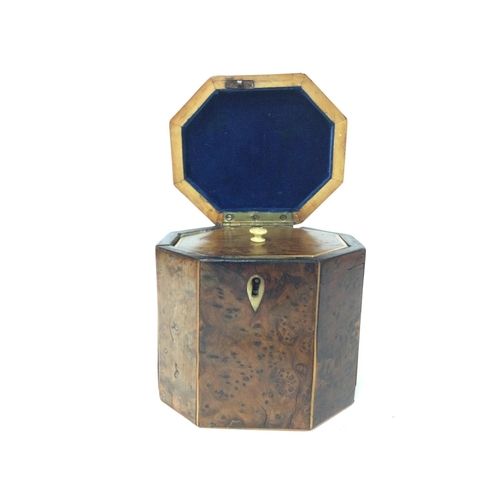 874 - A George III burr yew-wood Tea Caddy of octagonal form with a hinge lid and boxwood lines, with key.... 