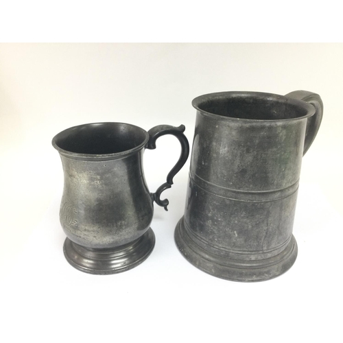 884 - Two 19th Century pewter tankards, largest approx 12.5cm. Shipping category B.