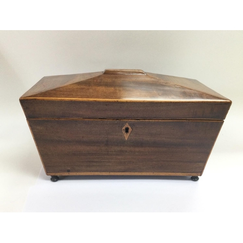 885 - An inlaid mahogany tea caddy of sarcophagus form, approx 29.5cm x 17.5cm x 16.5cm. Shipping category... 