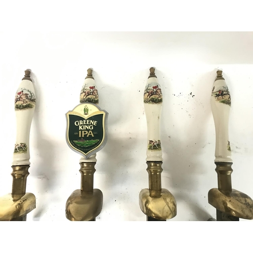 895 - Four beer vintage porcelain and brass pump handles