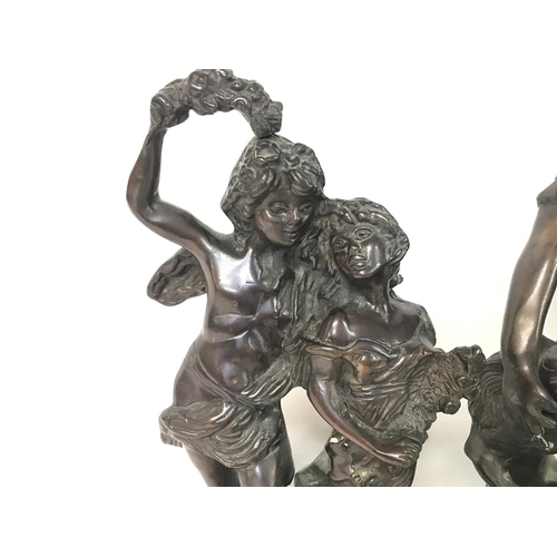 898 - Two spelter figures, a Greek warrior (42cm tall) & two children (32cm tall).