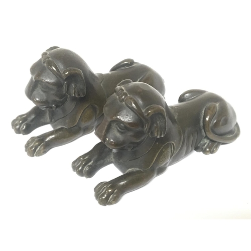 905 - A pair of 19th century small bronze figures of Regency style lions. (2) length 8.5cm