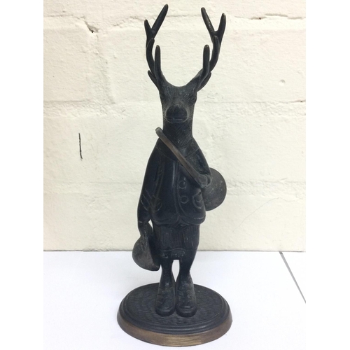 912 - Unusual bronze figure of a dresser stag with horn and hat, 25cm tall