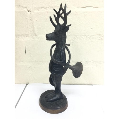 912 - Unusual bronze figure of a dresser stag with horn and hat, 25cm tall