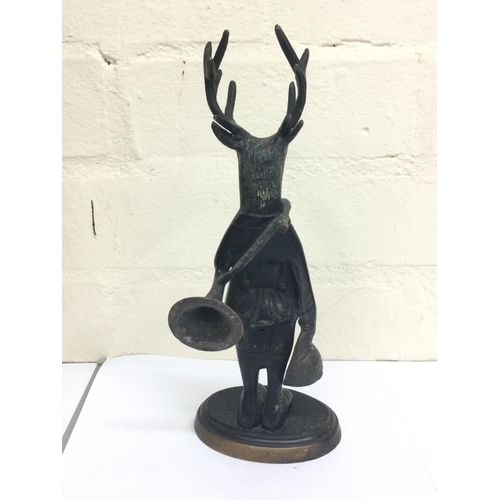 912 - Unusual bronze figure of a dresser stag with horn and hat, 25cm tall