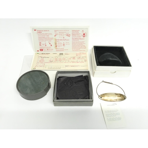 925 - A Concorde air ticket and other Concorde items including a silver drinks tag.