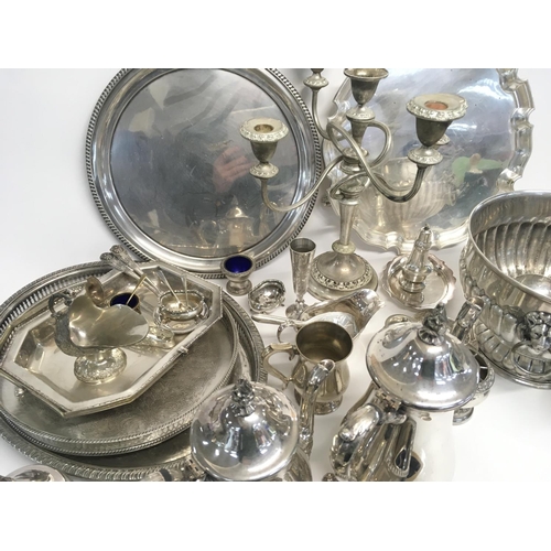 936 - A box of silver plated dinnerware including a candelabra, dishes, jugs etc (D)