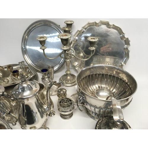 936 - A box of silver plated dinnerware including a candelabra, dishes, jugs etc (D)