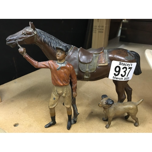 937 - A novelty lighter in the form of a jockey with horse and dog. The Jockeyâs head is detachable