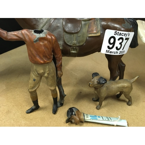 937 - A novelty lighter in the form of a jockey with horse and dog. The Jockeyâs head is detachable