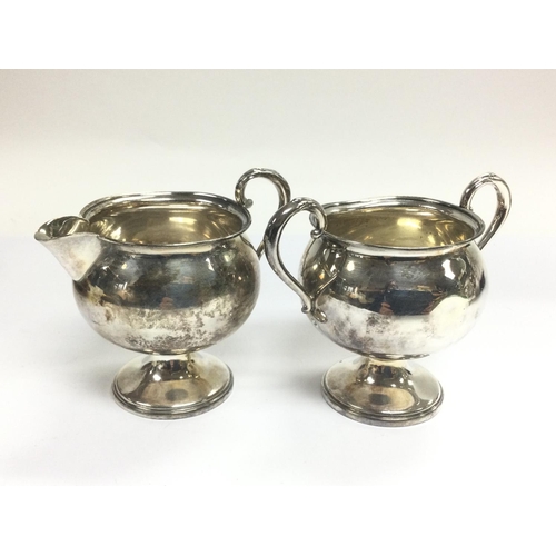 945 - A silver jug and conforming sugar bowl. Shipping category B.