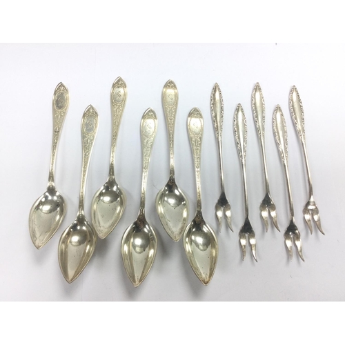 948 - Five silver pickle forks and six silver spoons. Shipping category A.