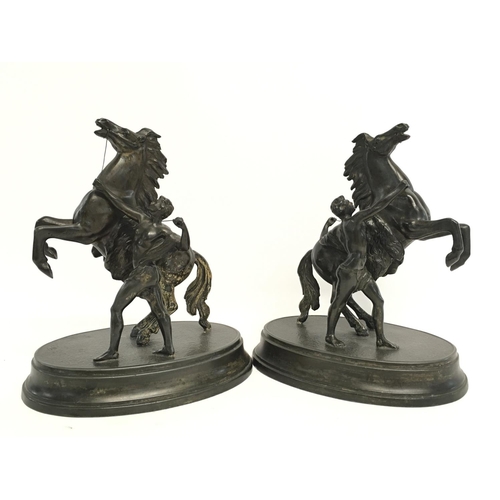 950 - A pair of spelter Marley horses, approximately 21cm tall.