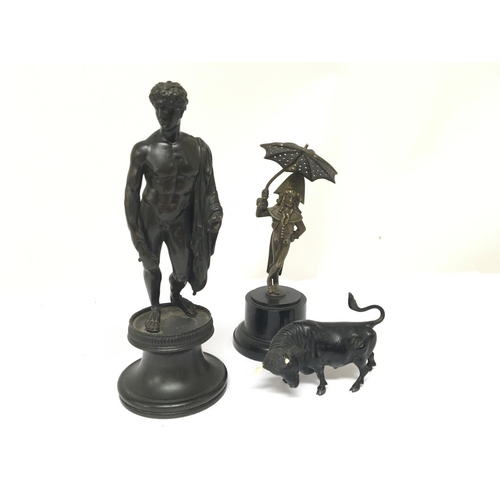 960 - A 19th century classical bronze figure a bronze in the form of a bull and one other cast metal figur... 