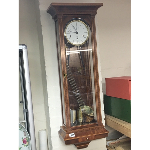 1511 - A Quality German walnut cased regulator wall clock with a visible brass pendulum and two weights. Ma... 