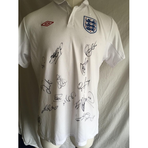 776 - England 2010 Signed Football Shirt: Unused original Ltd edition red Umbro badge shirt from 2010 sign... 