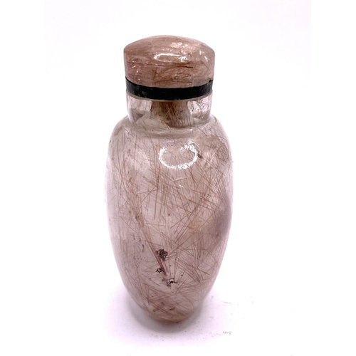 1 - A carved rutile hair Quartz (angel hairs) snuff bottle of ovoid form with matching stopper. 7.2cm. I... 