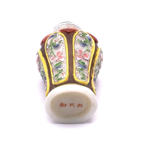 10 - A hand painted enamelled  milk glass snuff bottle with floral decoration, 6.7cm.