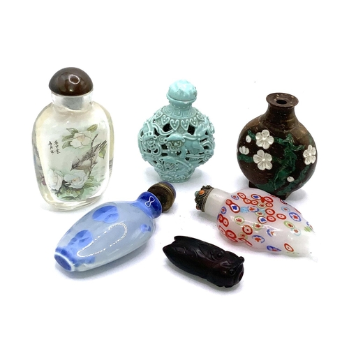 105 - A small collection of snuff bottles to include small millefiori glass example, Inside painted exampl... 