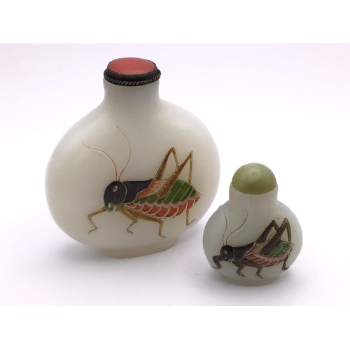 12 - 2 Milk glass snuff bottles both with hand painted enamelled crickets. 6.6cm/3.4cm