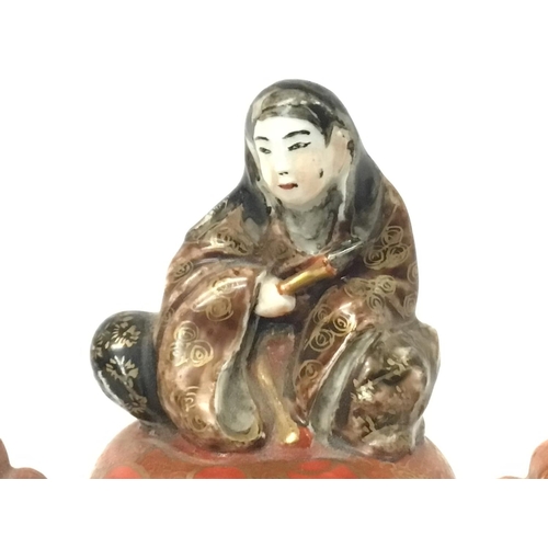 161 - A Japanese 19th century Kutani Koro with figure on lid, approximately 15cm tall. Postage cat D