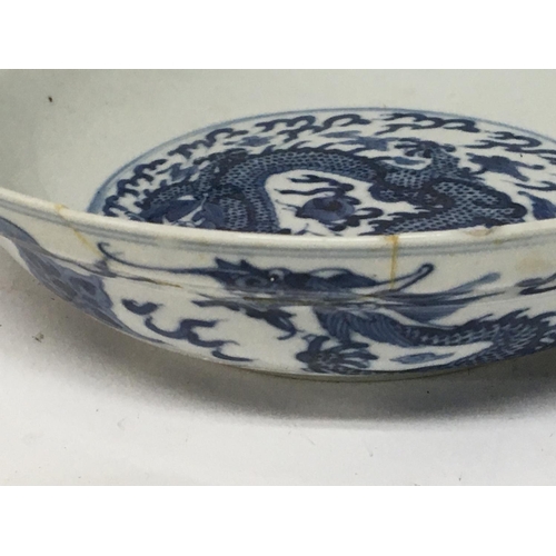 184 - Two Chinese blue and white Export porcelain Mid to late Qing Dynasty dishes decorated with dragons c... 