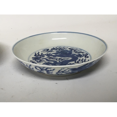 184 - Two Chinese blue and white Export porcelain Mid to late Qing Dynasty dishes decorated with dragons c... 