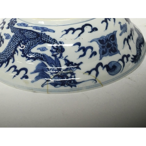 184 - Two Chinese blue and white Export porcelain Mid to late Qing Dynasty dishes decorated with dragons c... 