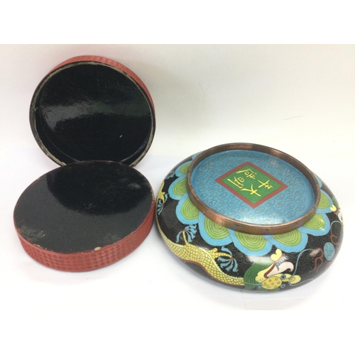 202 - A cinnabar jar and cover and a Cloisonne dish, approx diameter 20cm. Shipping category D.