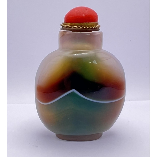 24 - A polished multicoloured banded agate snuff bottle, 5cm.