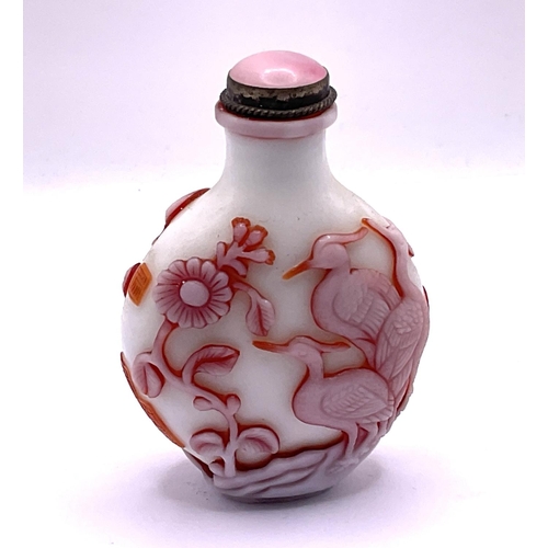 35 - A 2 layered milk glass cameo glass snuff bottle with decoration of Cranes and flowers, signature pan... 