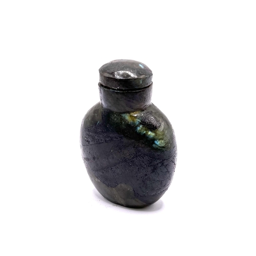 37 - A polished labradorite snuff bottle with matching stopper, 6.5cm.