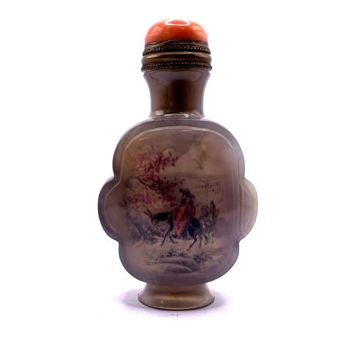 39 - A finely carved and polished inside painted agate snuff bottle in cloud form, with brass mounted cor... 