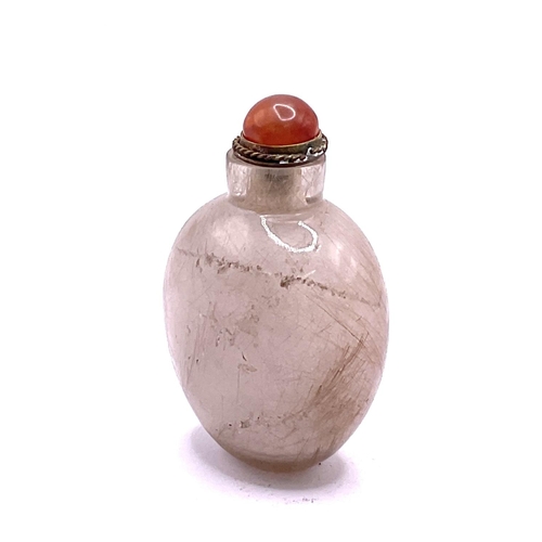 41 - An ovoid form hairs fur rock crystal snuff bottle. 6.5cm