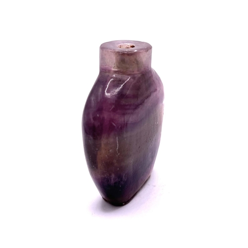 45 - A 19thC banded amethyst snuff bottle, 7.5cm, with Chinese customs export label attached.