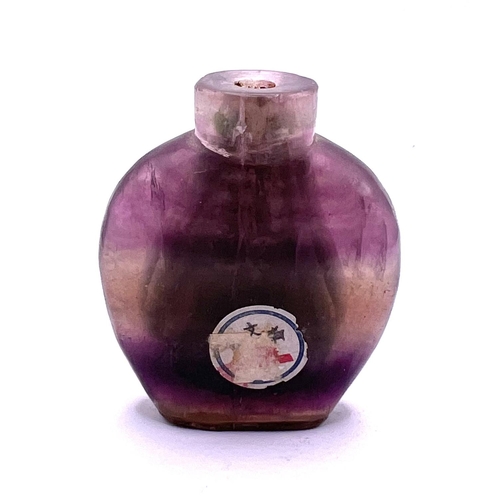 45 - A 19thC banded amethyst snuff bottle, 7.5cm, with Chinese customs export label attached.