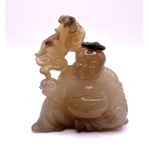 49 - A carved agate hard stone. Snuff bottle in the form of a Buddha, the stopper carved as a bat symbol.... 