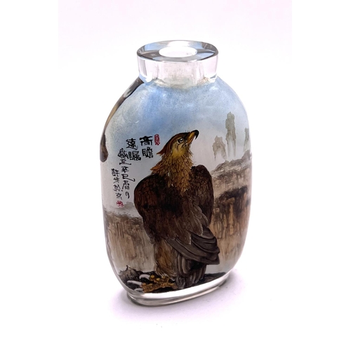 50 - A very finely detailed inside painted snuff bottle, each side with views of an eagle amongst cliff t... 