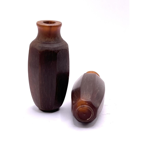 55 - 2 similar octagonal form carved horn snuff bottles. 5.6cm.