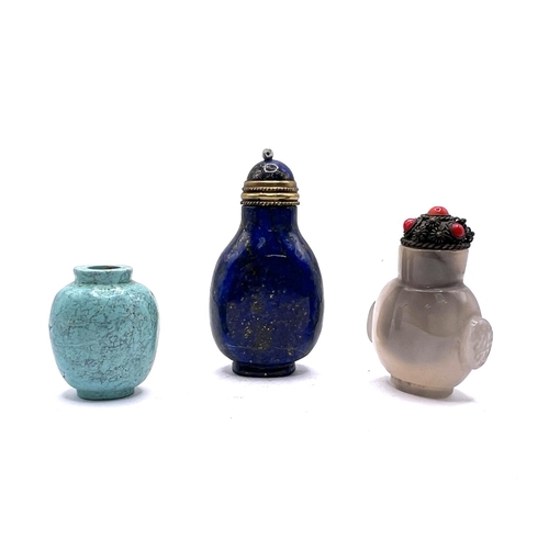 56 - 3 miniature snuff bottles to include a polished turquoise example 3cm, a carved and polished lapis l... 