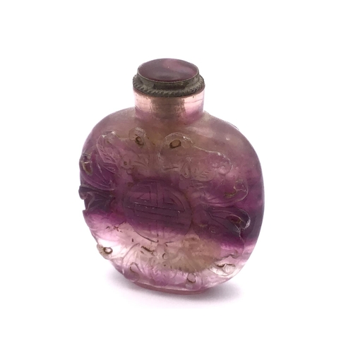 6 - A carved amethyst rock crystal snuff bottle the decoration depicting symbols of five bats which repr... 