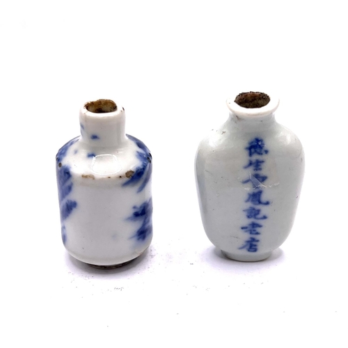 60 - 2 small hand painted blue and white porcelain snuff bottles, 4.2cm.