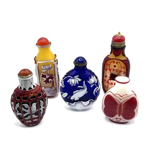 67 - 5 Chinese carved cameo glass snuff bottles. Tallest 7.2cm.