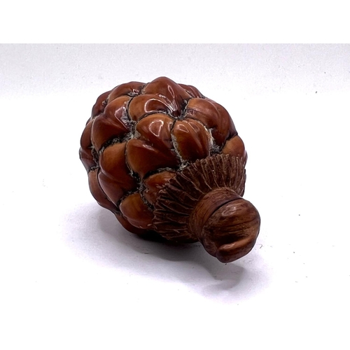 68 - A Chinese pinecone repurposed for use a a snuff bottle. 7.5cm